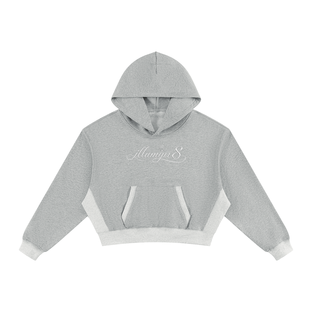 A light gray cropped hoodie with contrasting white side panels, a white front kangaroo pocket, and white ribbed cuffs and hem, shown against a plain white background.